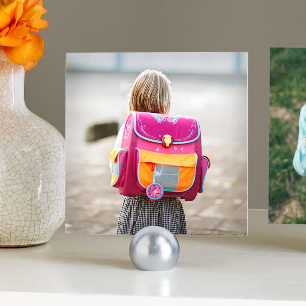 Create and share multiple prints of your child looking tiny and precious wearing their big new school bag.