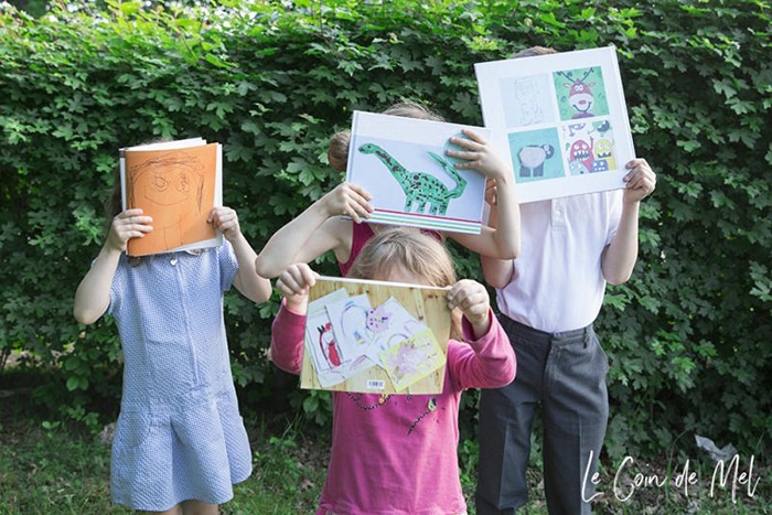 Kids holding art books