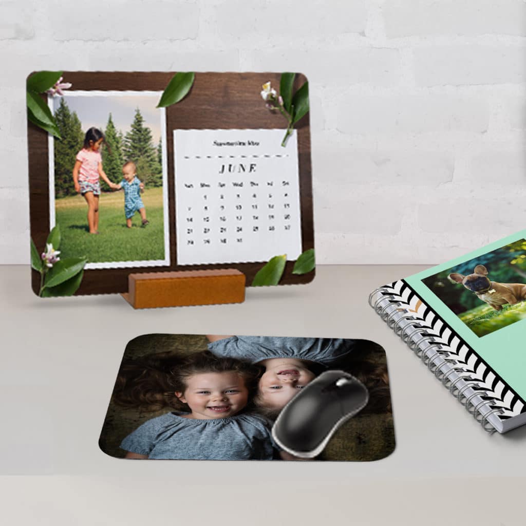 Snapfish desk accessories including a mousepad, notebook, and desk calendar