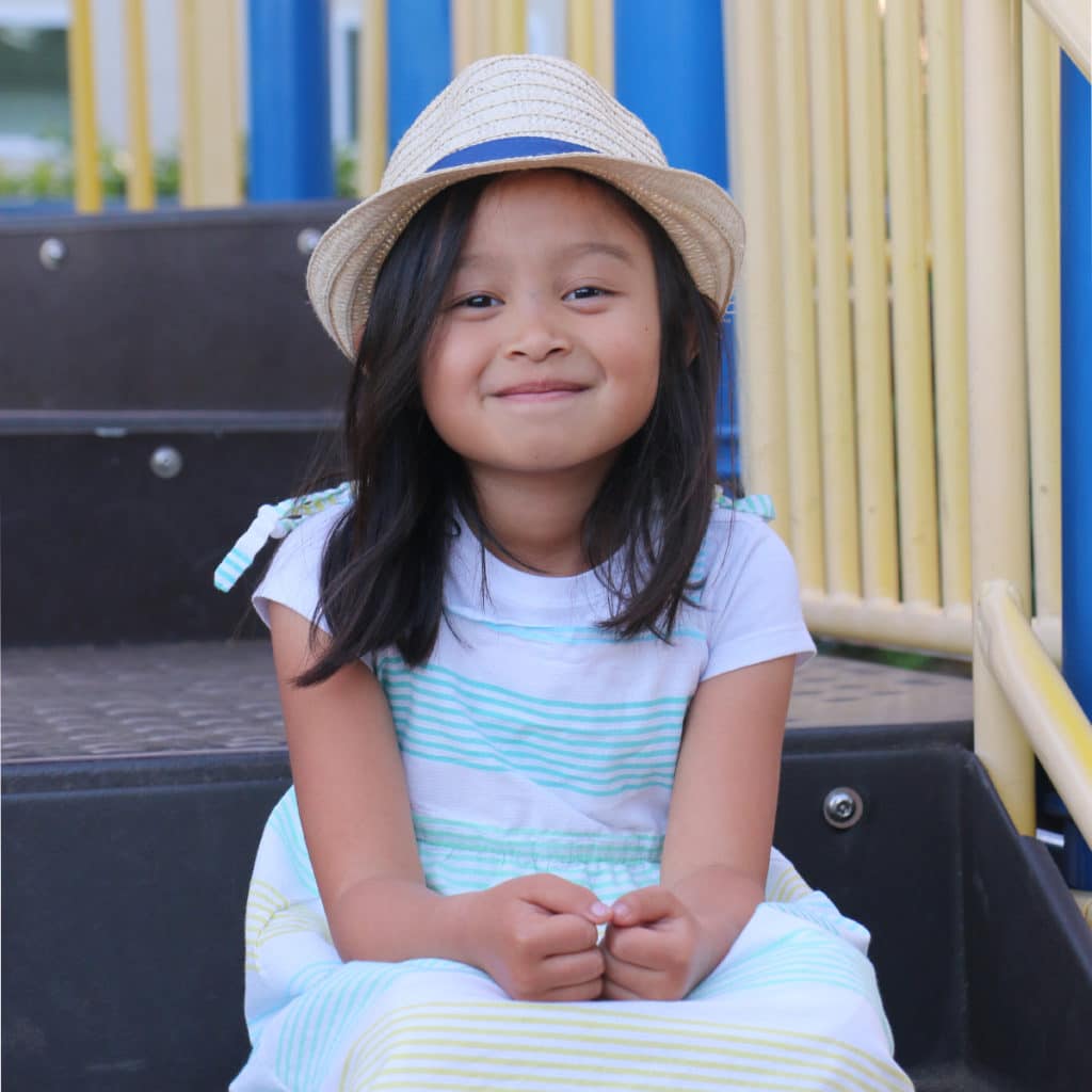 Little girl smiling at the playground