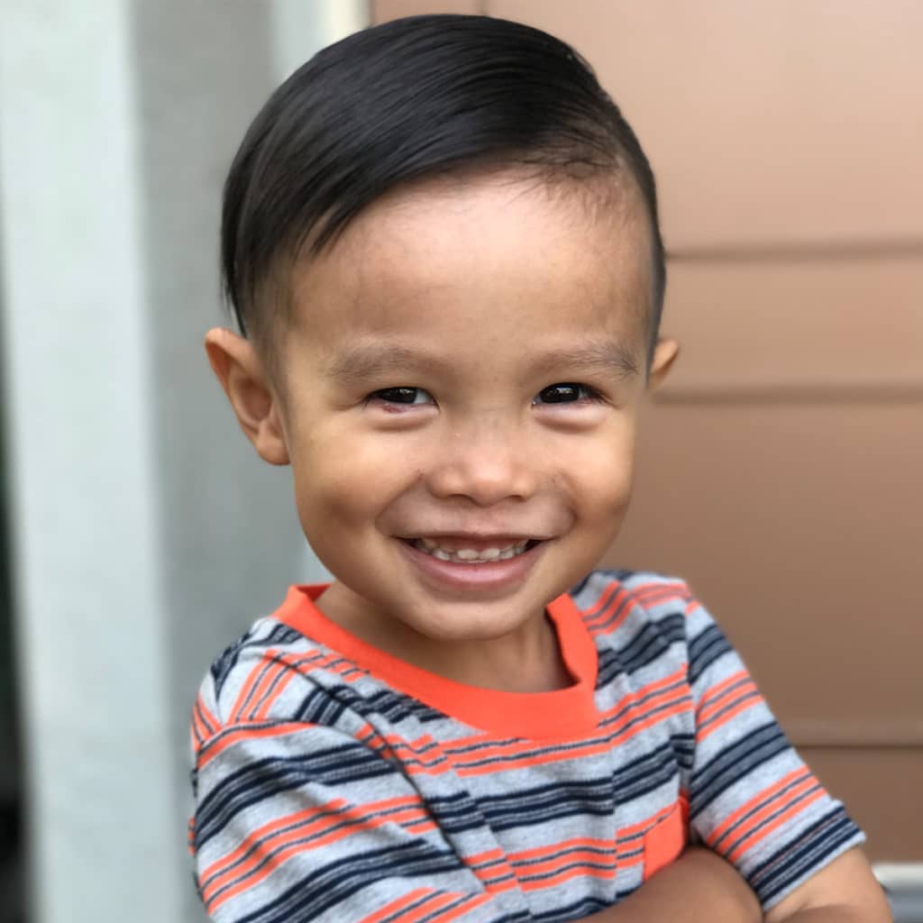 Close up photo of little boy smiling