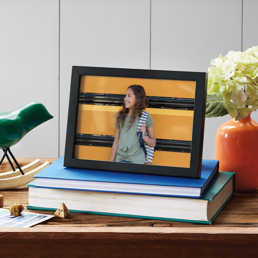 Framed photo print featuring little girl in front of the school bus