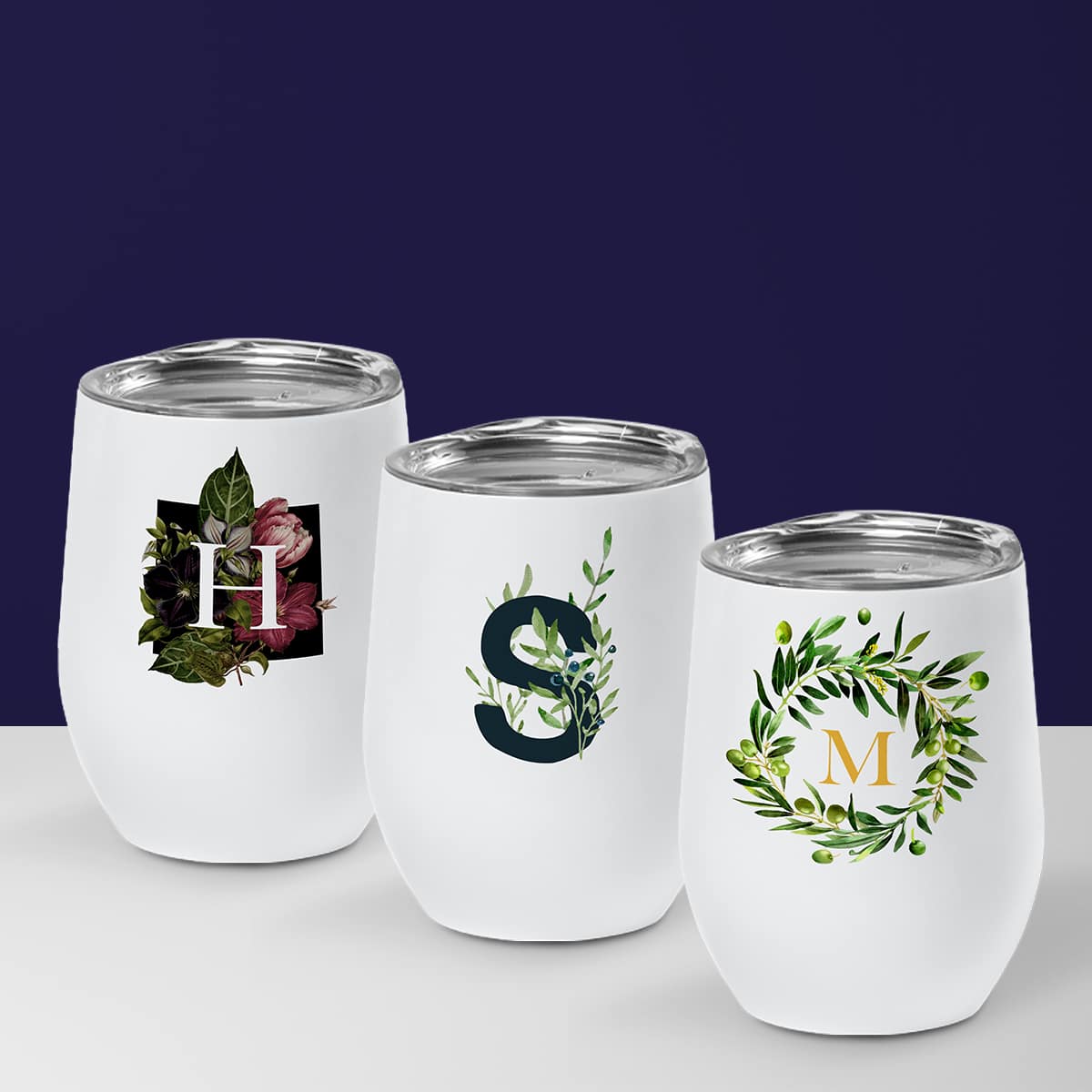 Three wine cups with monogram designs