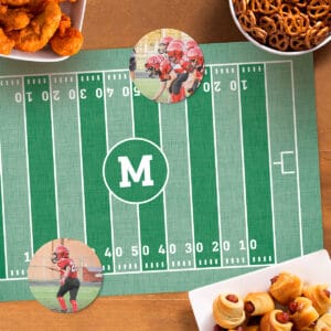 Personalized trivets featuring football photos sitting on top of a football field placemat