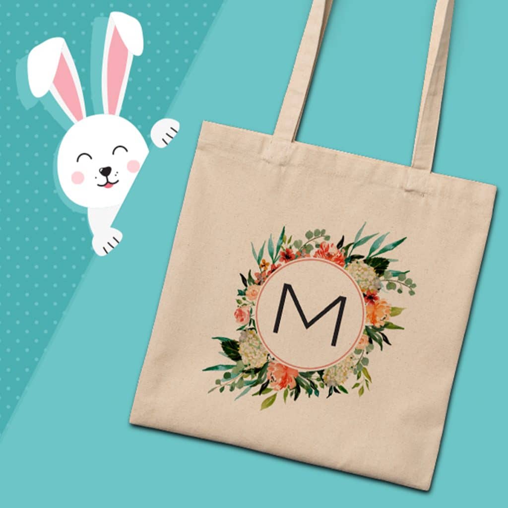 Everyday canvas tote bag with floral design around a letter M