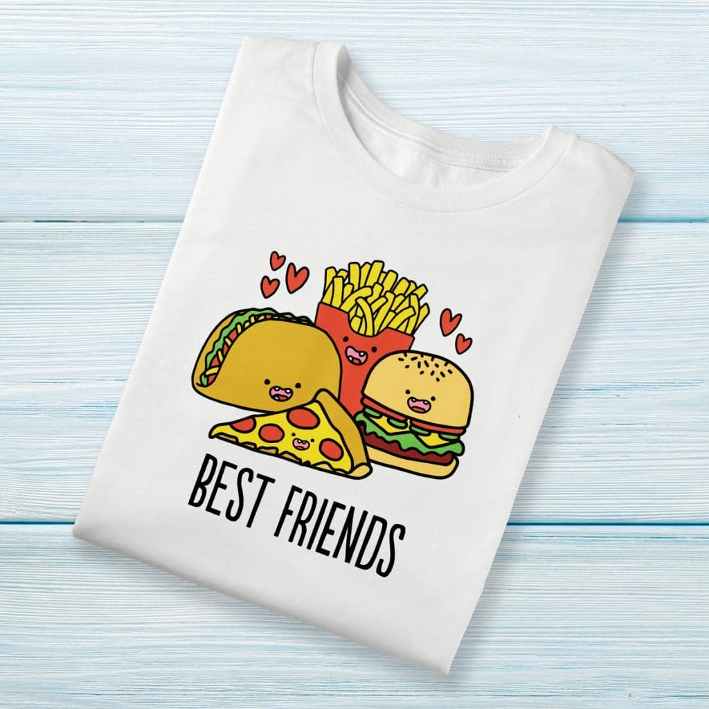 White t-shirt featuring a cartoon-style design of a taco, a burger, a piece of pizza, and fries that reads "BEST FRIENDS"