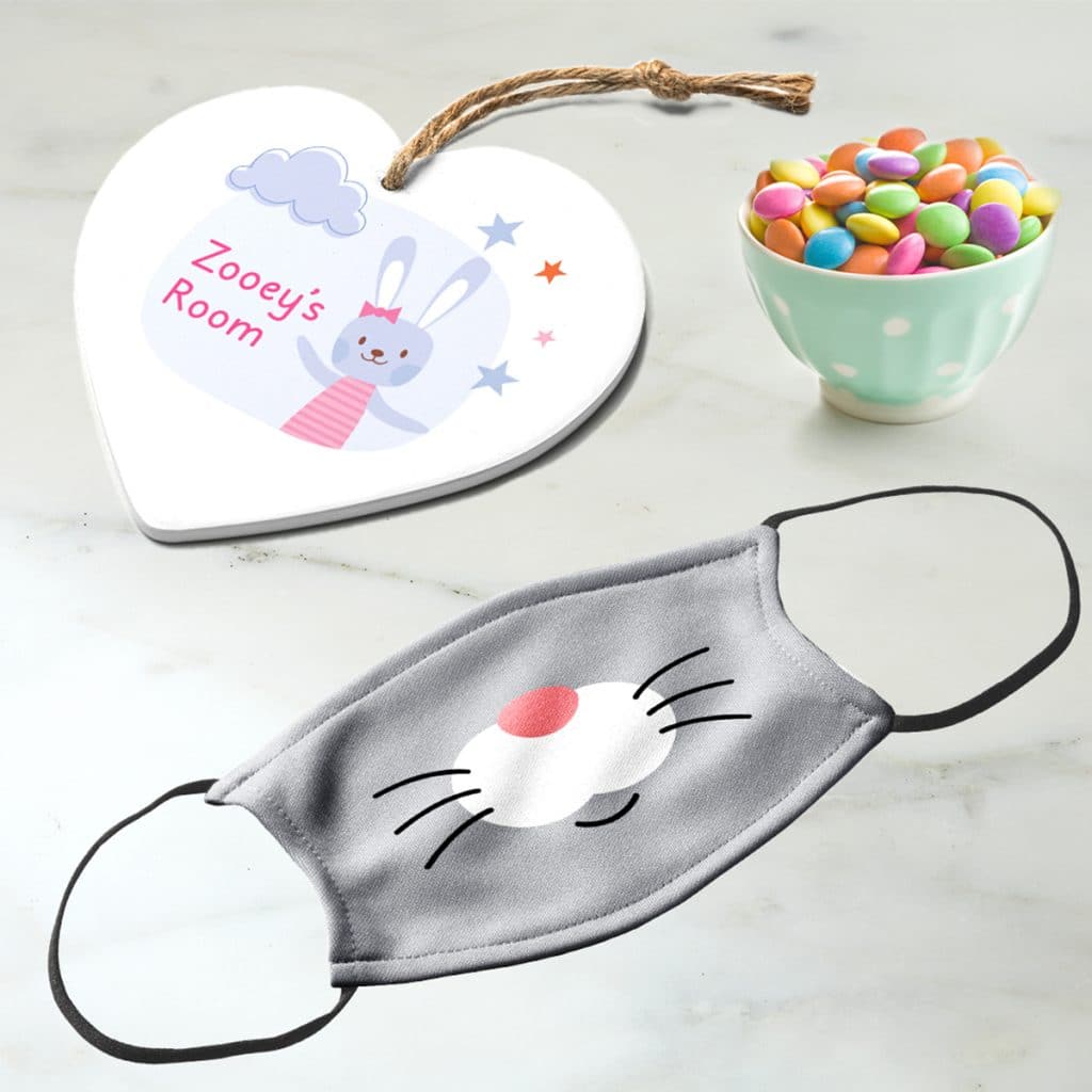 Bunny nose face mask and heart shaped trivet that reads "Zooey's Room"
