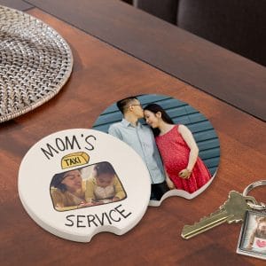 Car coasters featuring "Mom's Taxi Service" design and a full photo option sitting on a table next to a set of keys