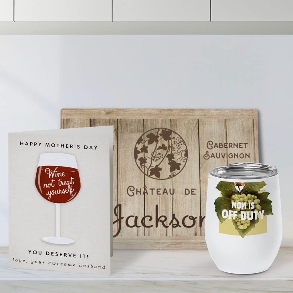 Wine-themed Mother's Day card with a glass cutting board featuring the wine crate design, and an insulated wine tumbler showcasing a custom grape design