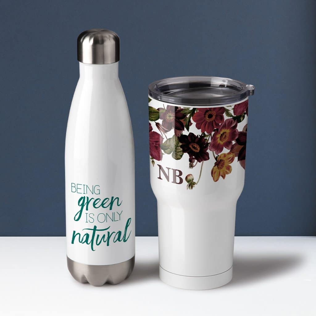 Insulated water bottle that reads "Being green is only natural" and an insulated tumbler with a moody floral design.