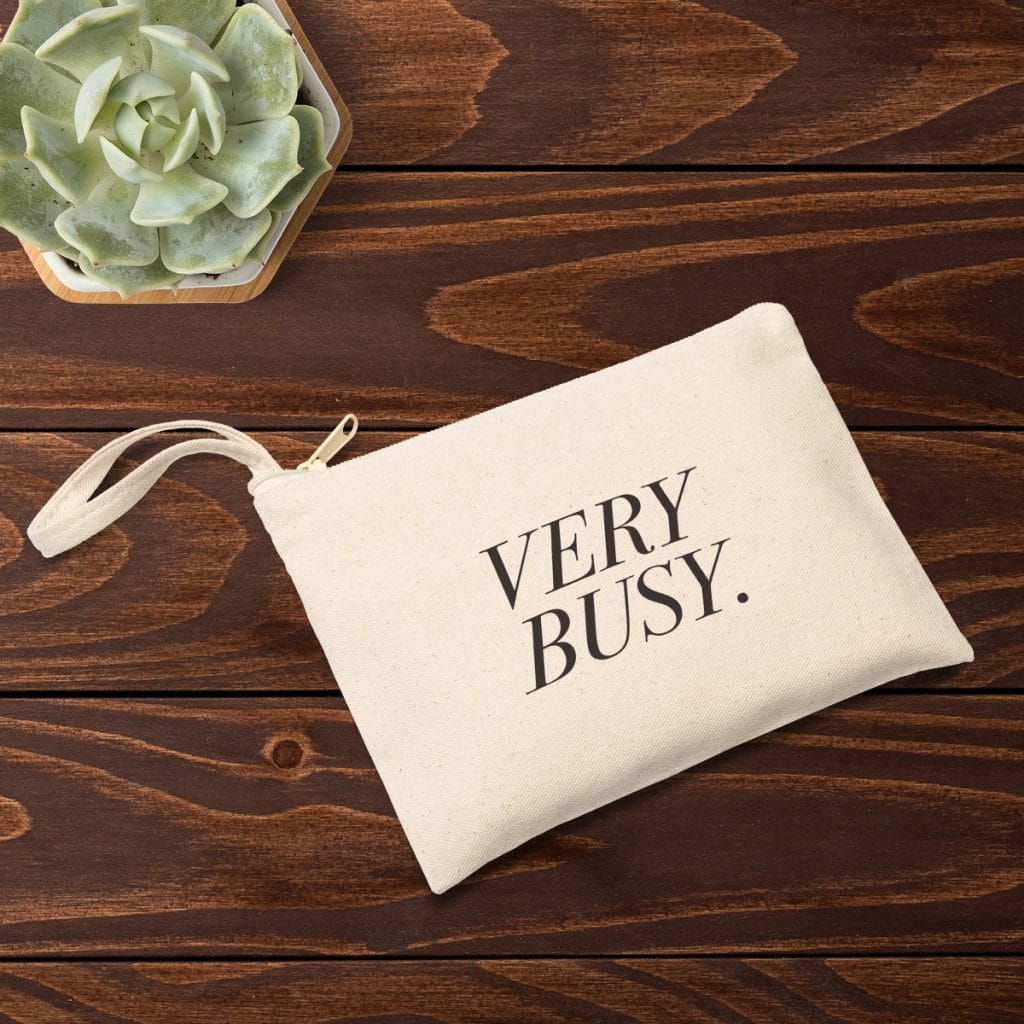 Zippered canvas pouch with "VERY BUSY." design