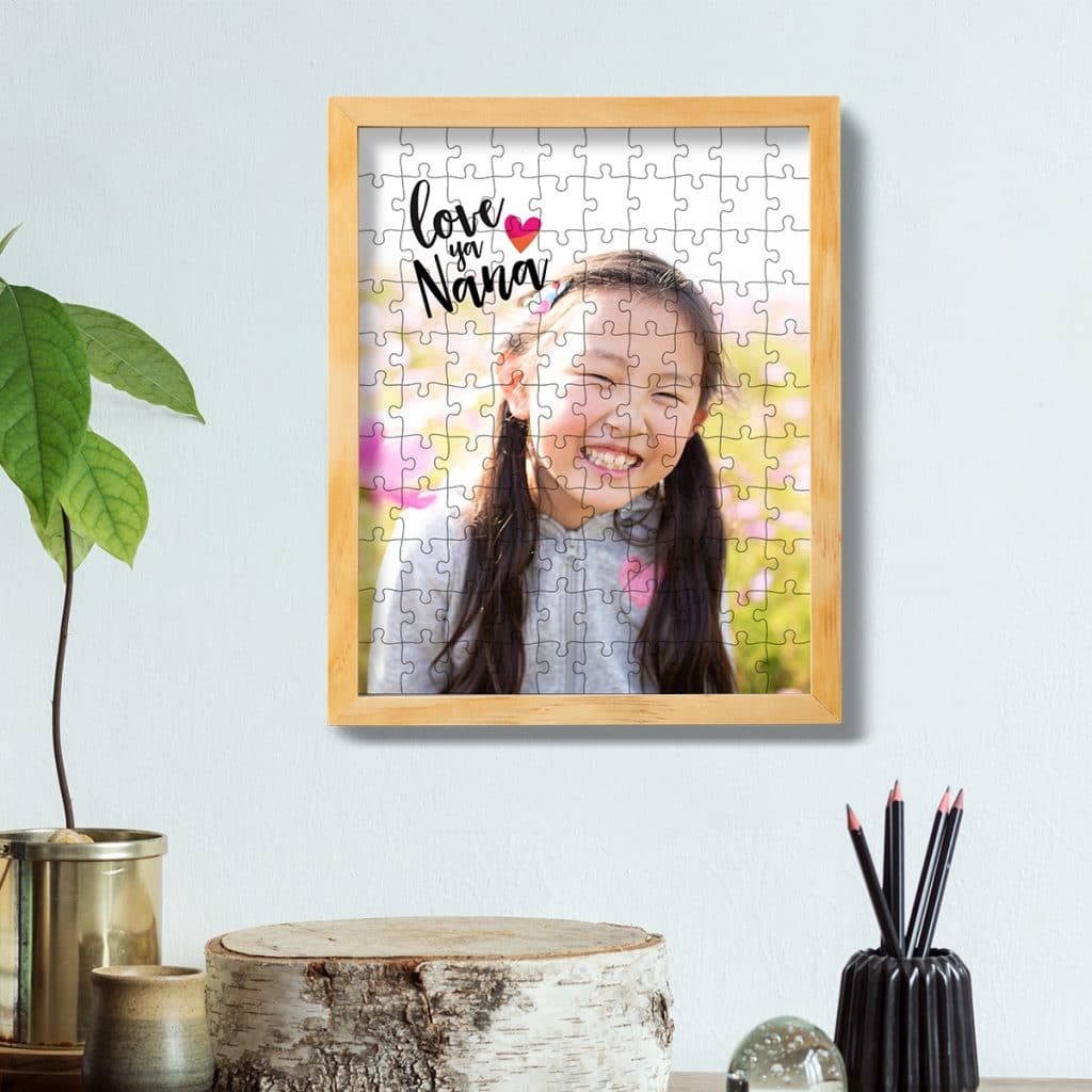 110 piece photo puzzle featuring smiling girl framed and hung on a wall