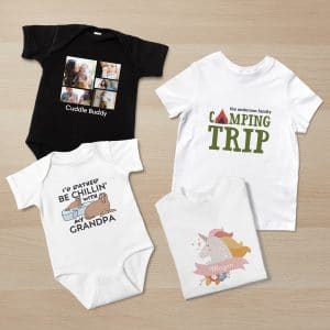 Photo of a flat lay featuring different designs on baby bodysuits and toddler t-shirts