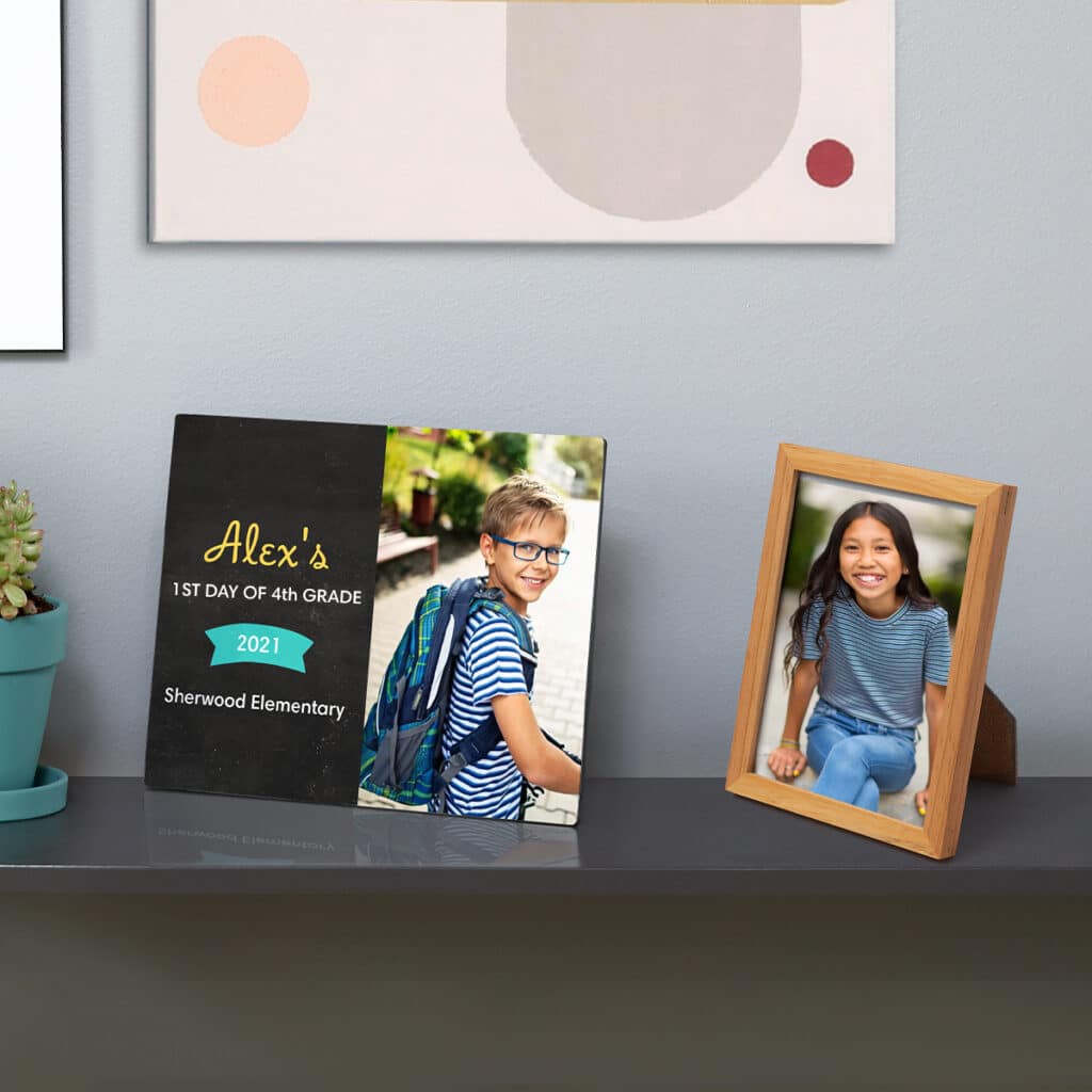 Image of a tabletop panel and framed photo print sitting on a shelf