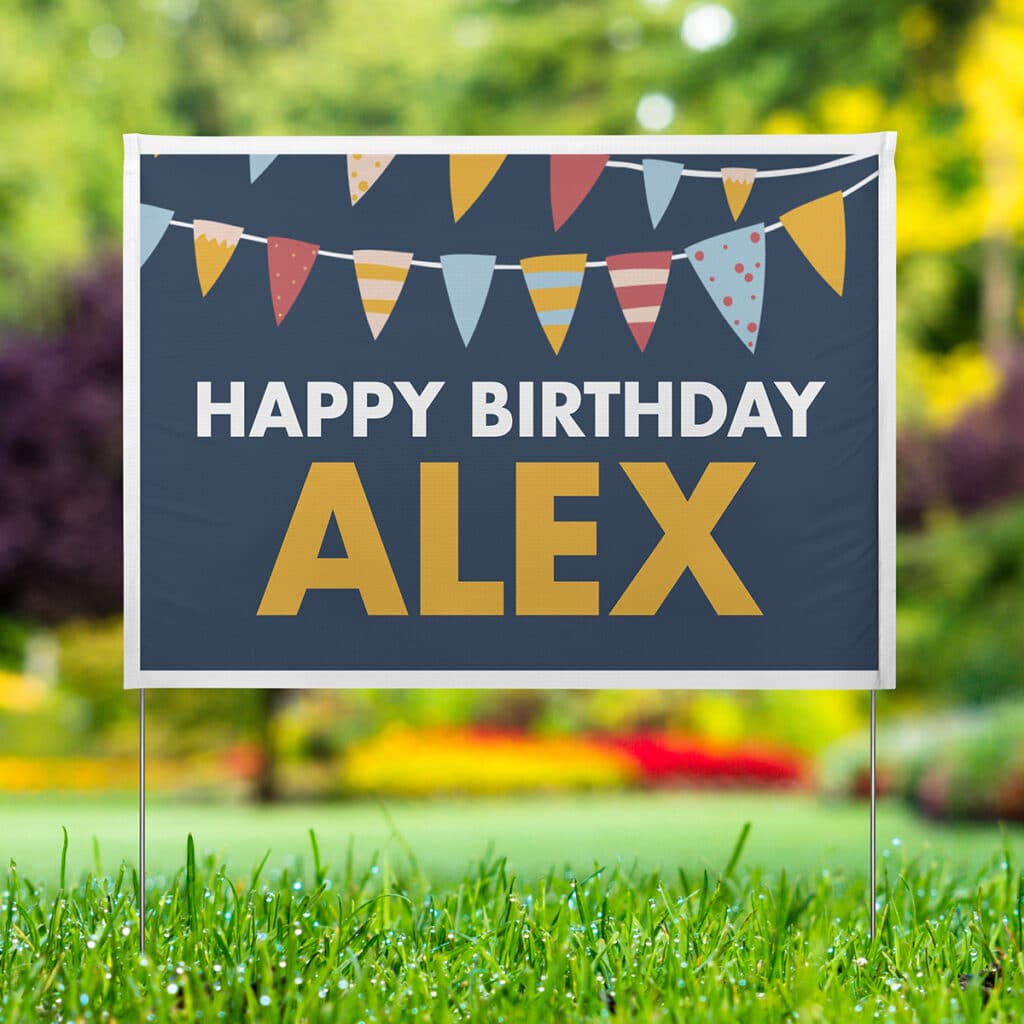 Image of a custom yard sign on a lawn that reads "Happy Birthday Alex".