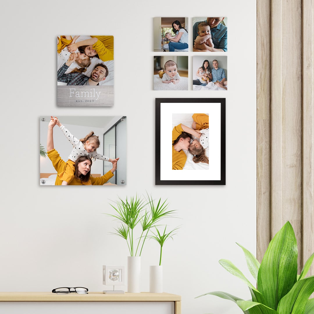 wall art selection with photos of a lovely young family