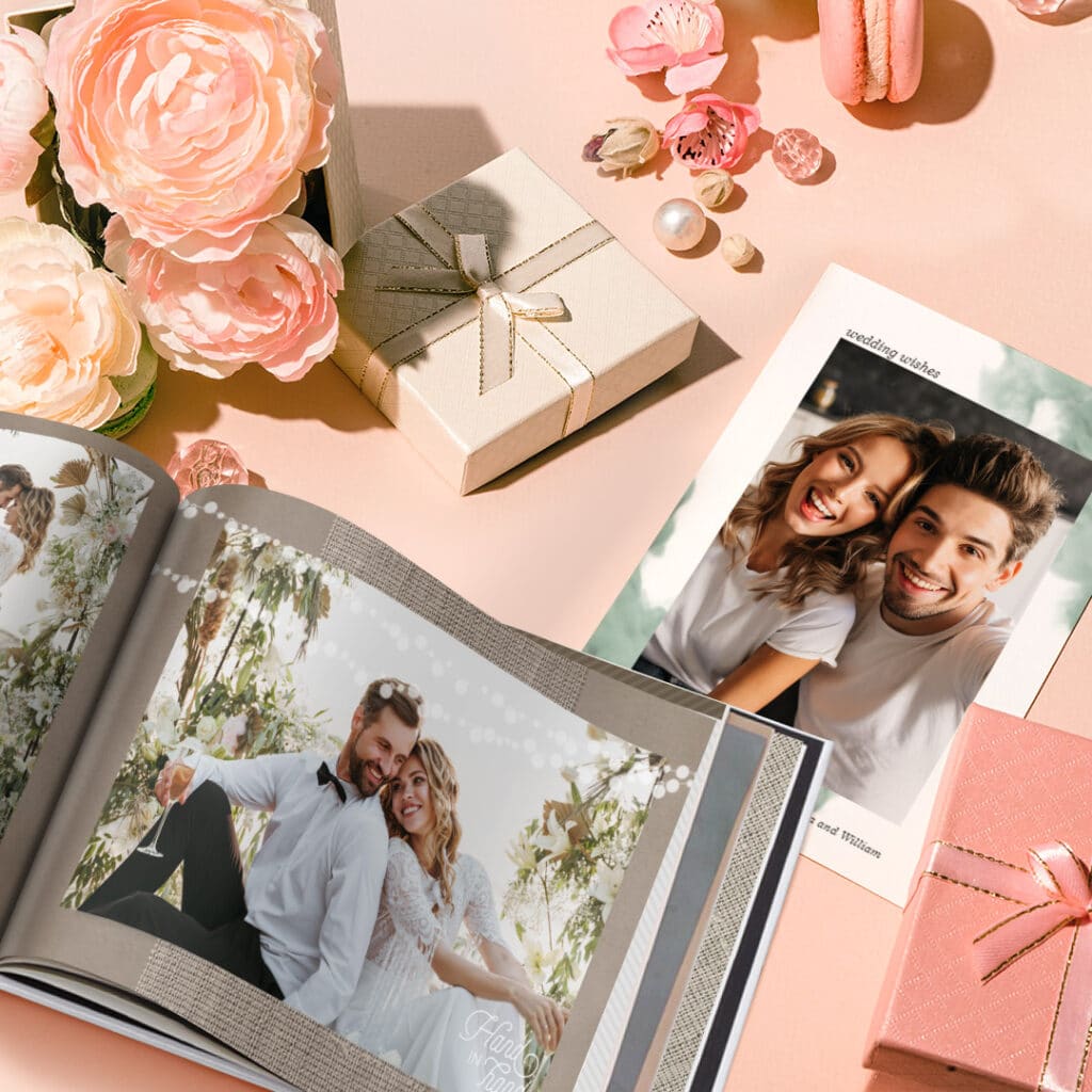 a photo book and wedding day card surrounded by wedding decorations