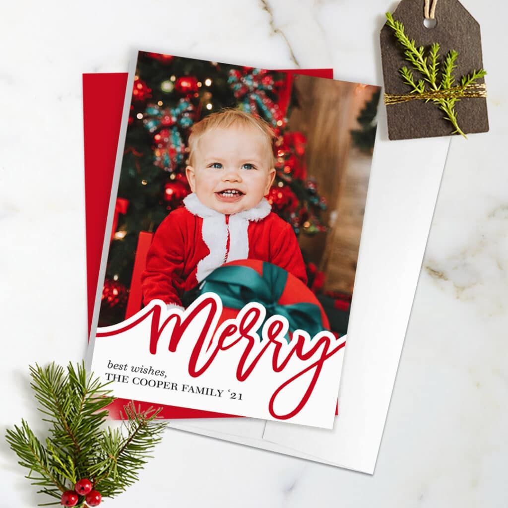 photo card with surrounding holiday greenery