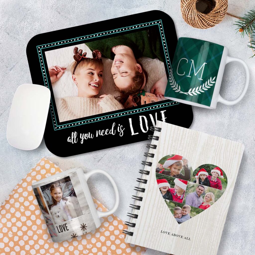 a personalized mousepad, 2 Christmas mugs and a spiral notebook with images of a lovely family