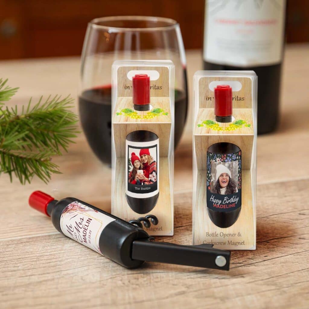 open and packaged corkscrew wine magnets sit on wooden surface