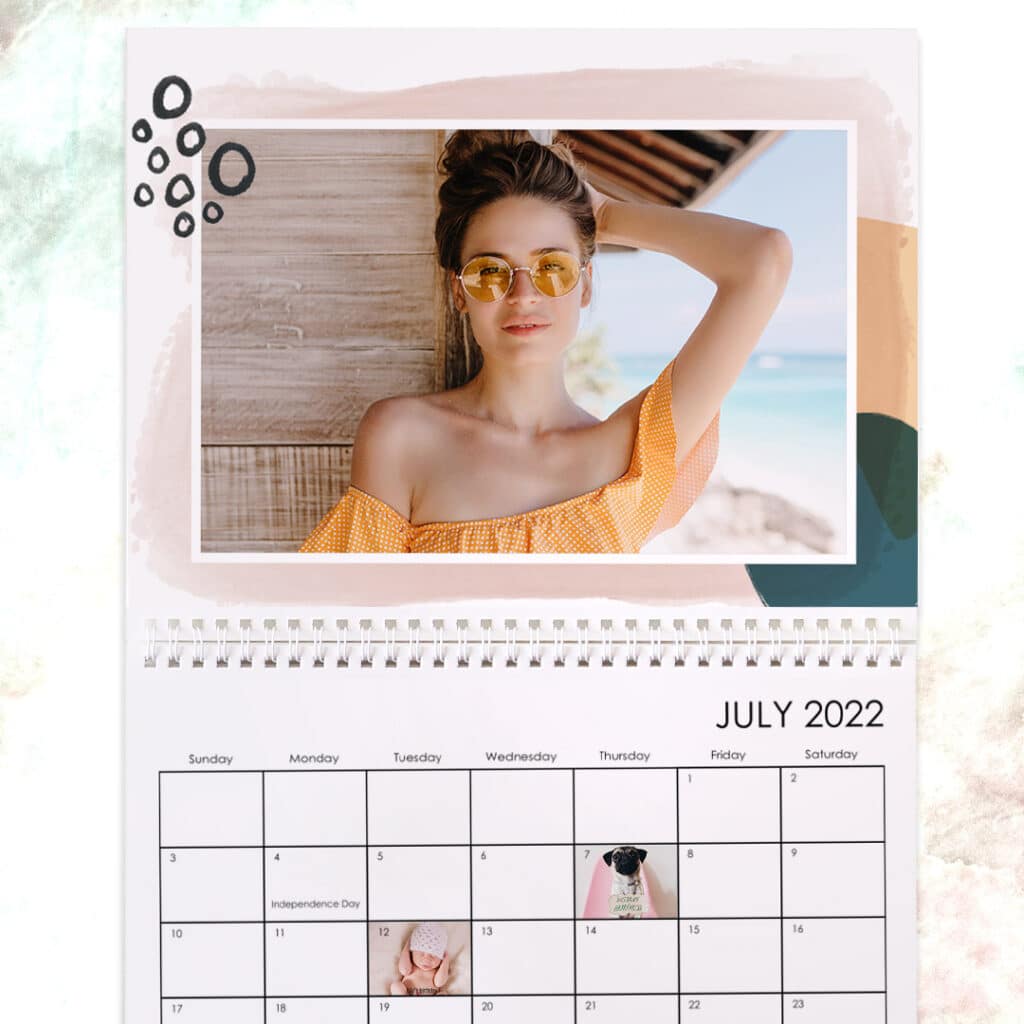 the month of July shown on a wall calendar with Watercolor Sketchbook design and customized special dates