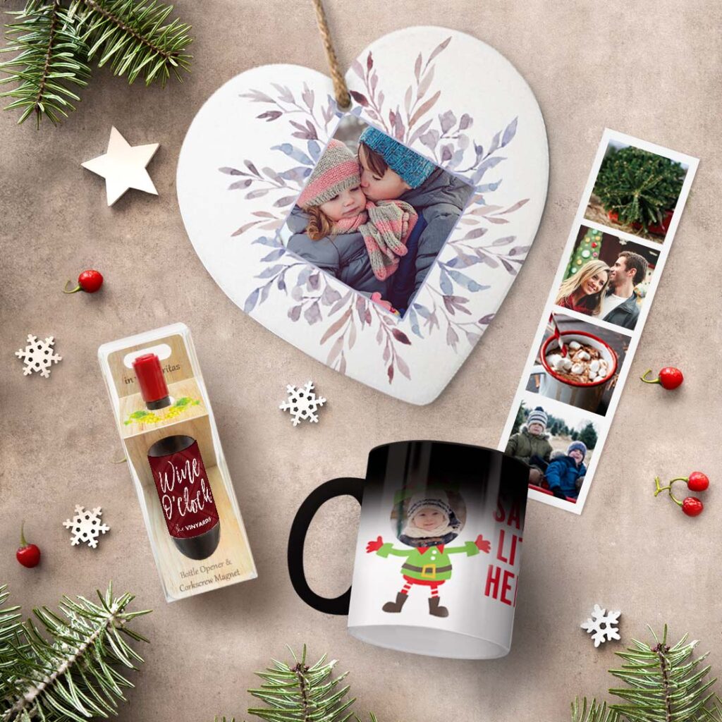 A selection of personalized Christmas gifts: a magnetic bottle opener, a magic mug, a heart trivet, magnetic photo booth strips