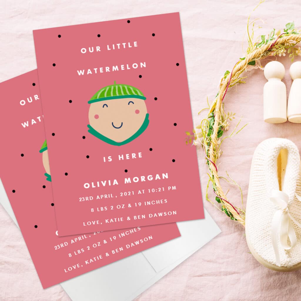 Our little watermelon is here, a funny custom baby birth announcement card placed next to white baby shoes