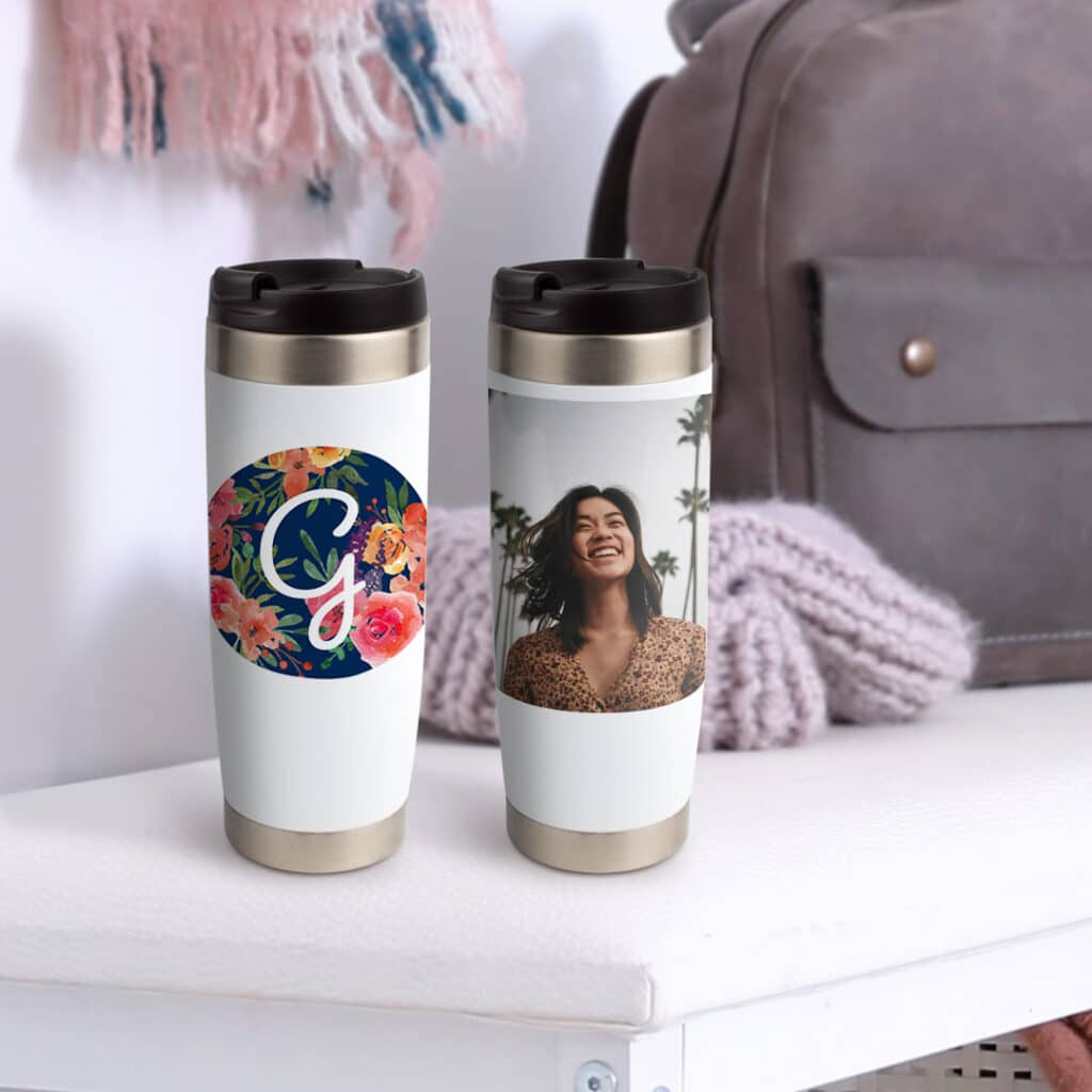 two travel mugs printed with photos on shelf